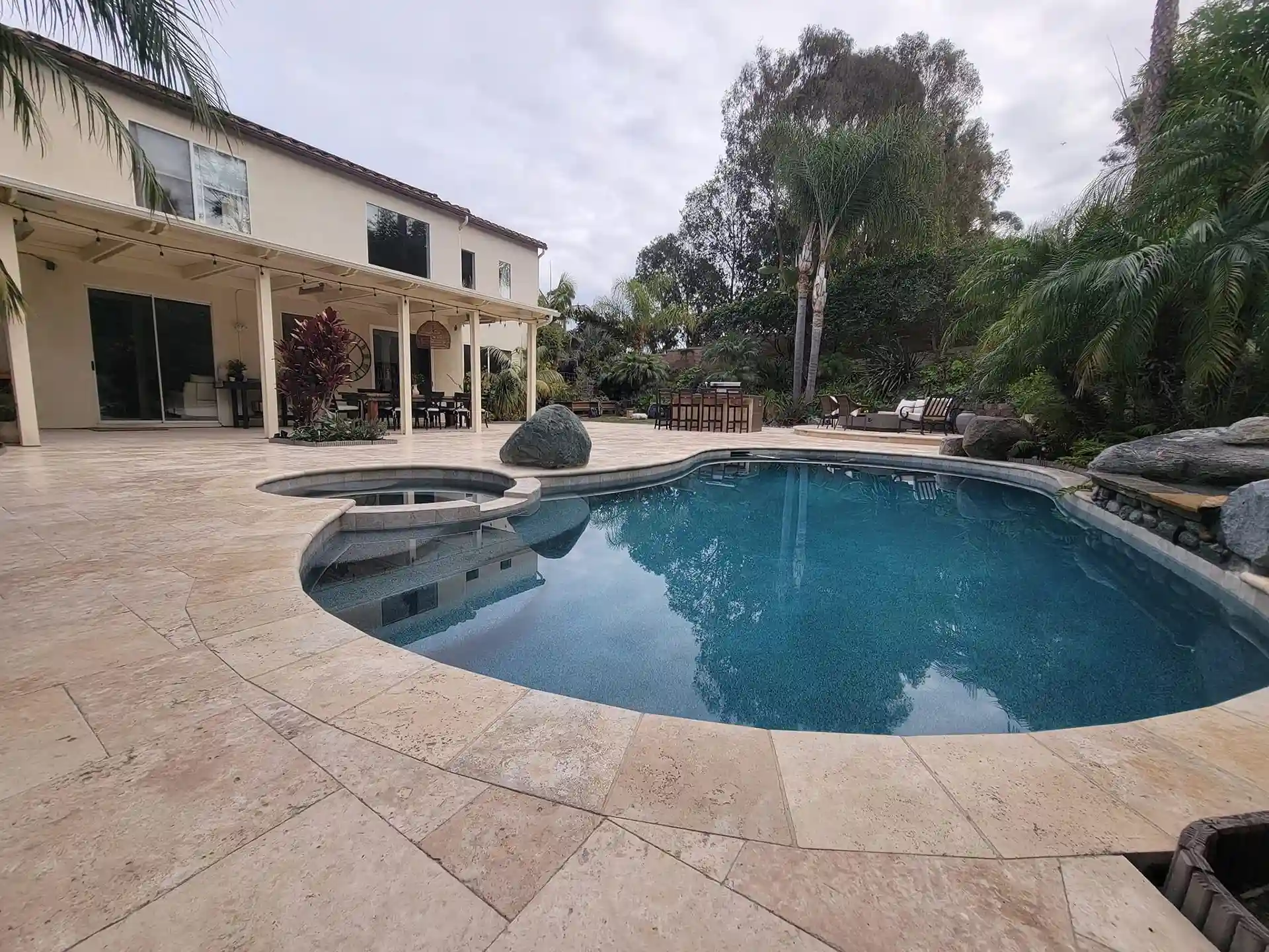 Photo of a paver patio and paver pool deck 